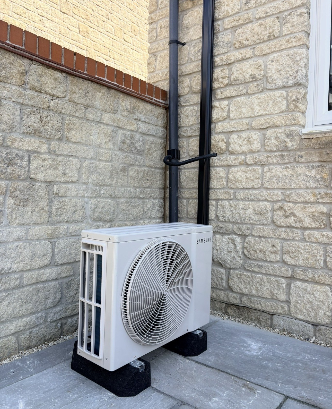 Samsung outdoor AC installation on stone wall