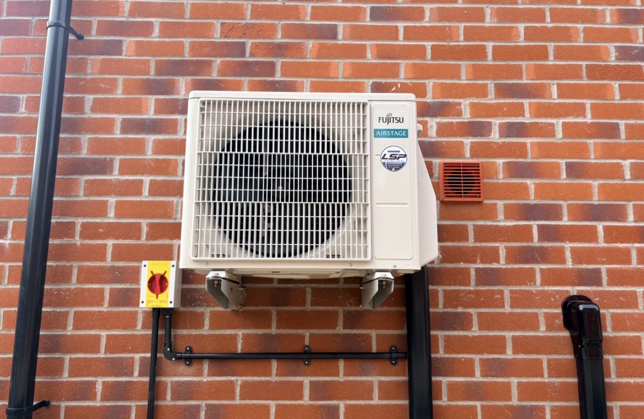 Outdoor unit on red brick