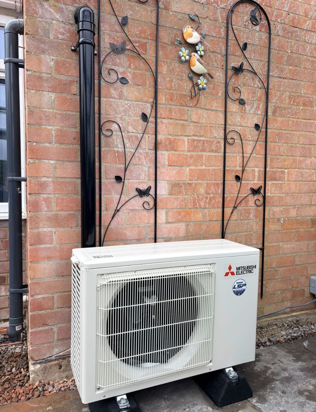 Mitsubishi outdoor installation on brick