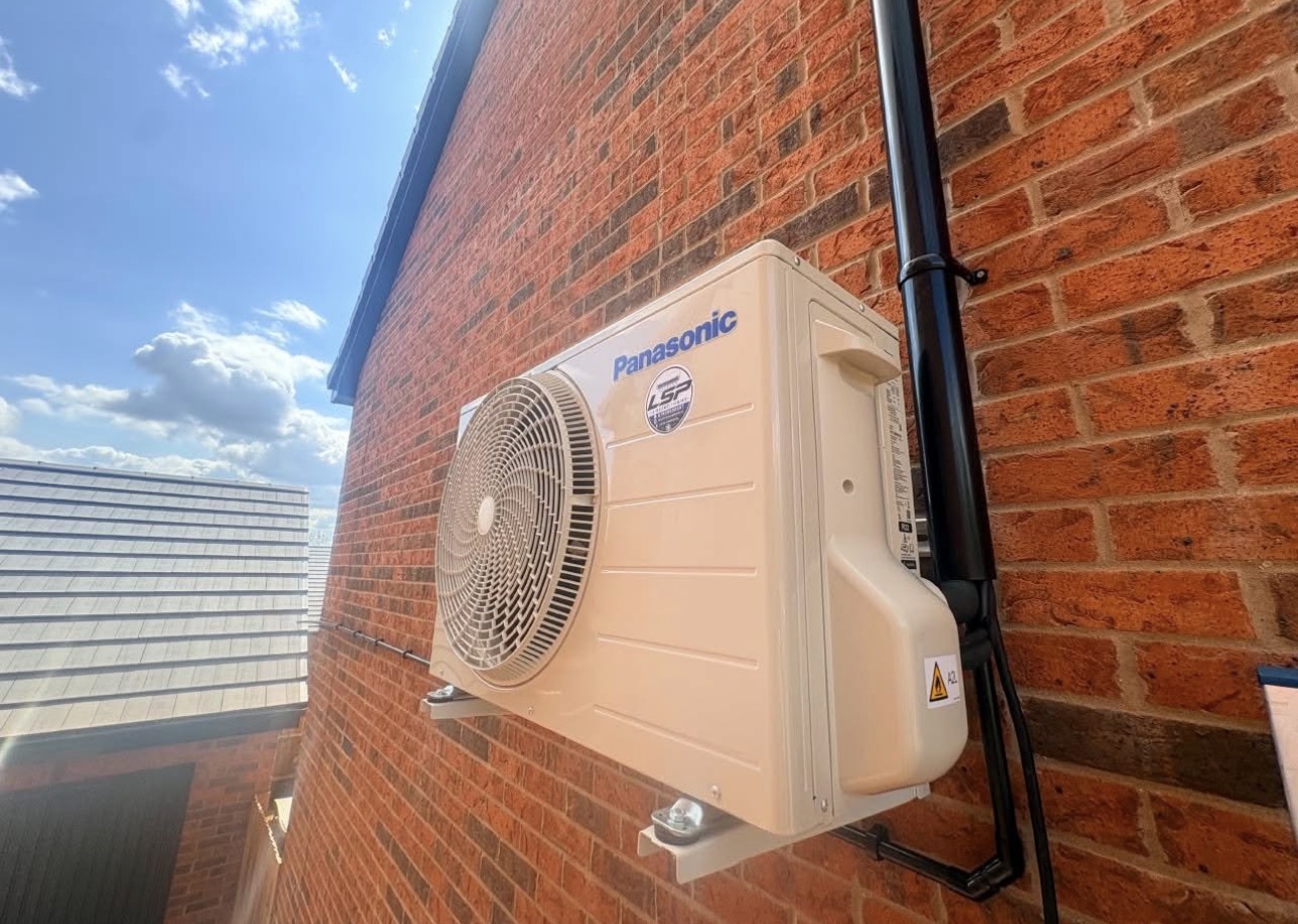 Outdoor unit on a brick wall